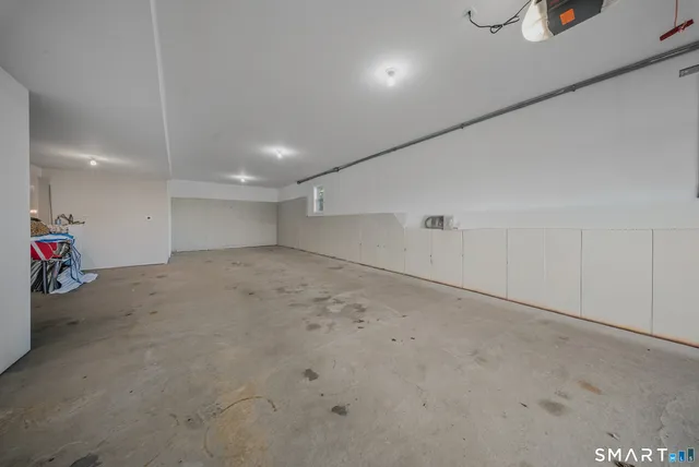 a view of a deck with two chair and wooden floor