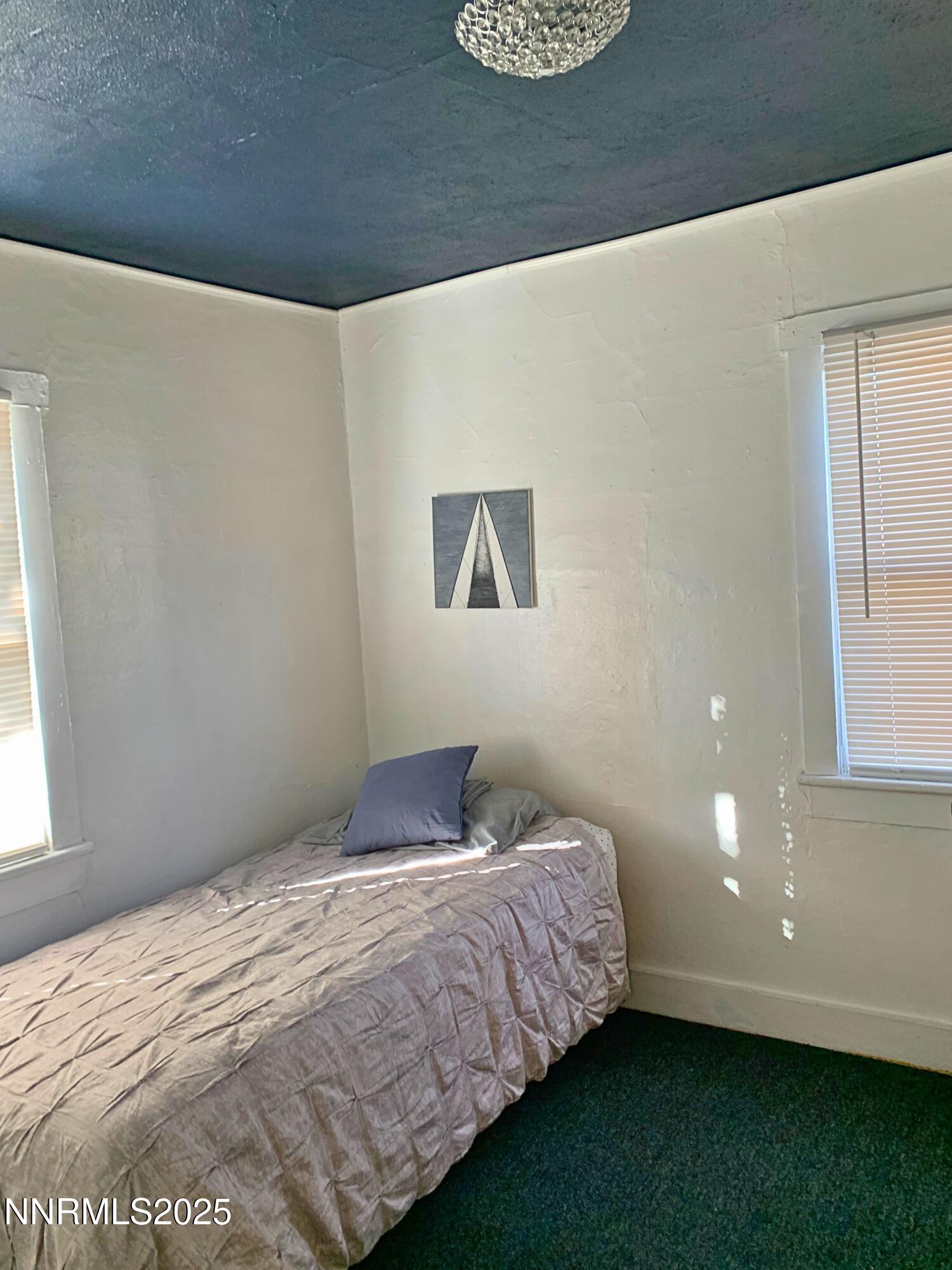 1151 Seminary Avenue Reno, NV 89503 - Photo 12 of 12 a bedroom with a bed and a window