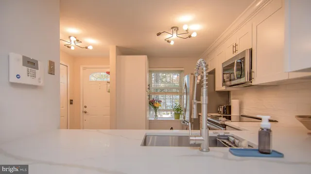 a bathroom with a tub sink and mirror