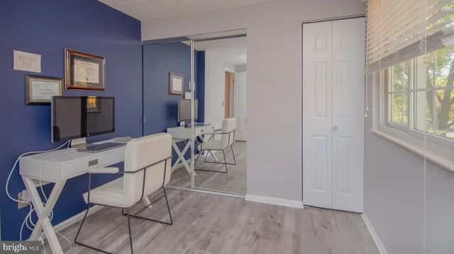 a room with a fan and a window