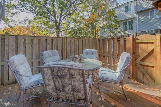 a view of a brick house with a yard and plants