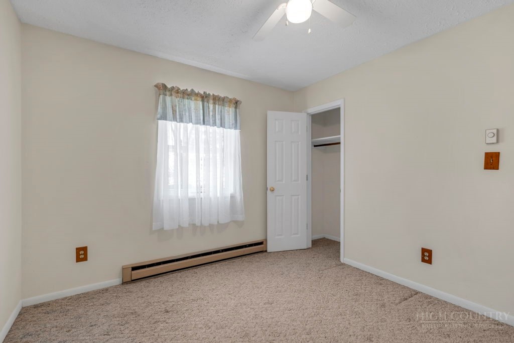 163 Rolling Hill Drive Boone, NC 28607 - Photo 15 of 40 an empty room with windows
