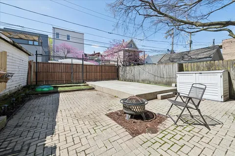 a picture of a bench in front of a building