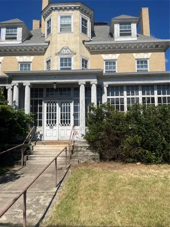 a view of a building with a garden