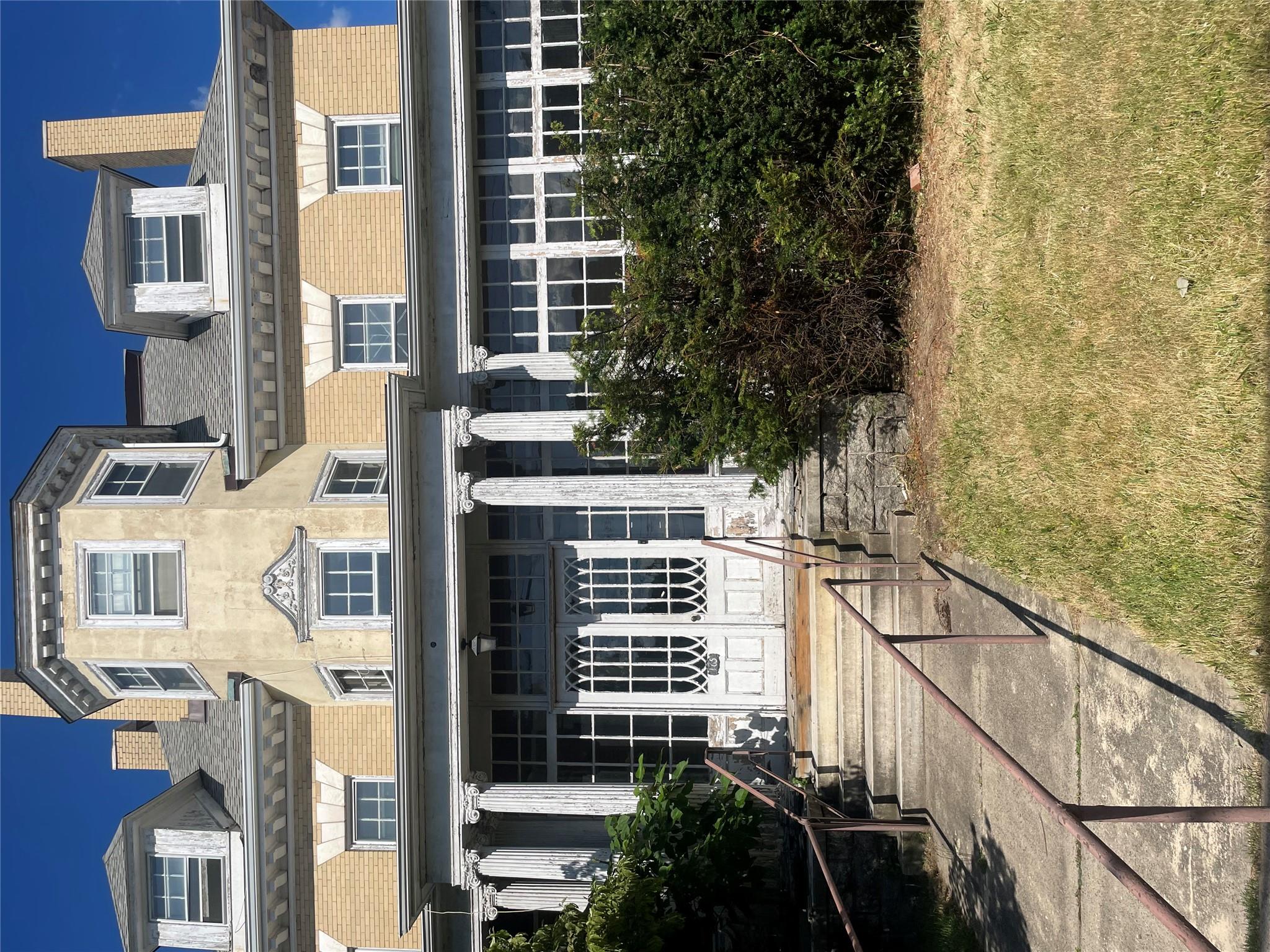 165 Summit Avenue Mount Vernon, NY 10550 - Photo 2 of 3 a view of a building with a garden