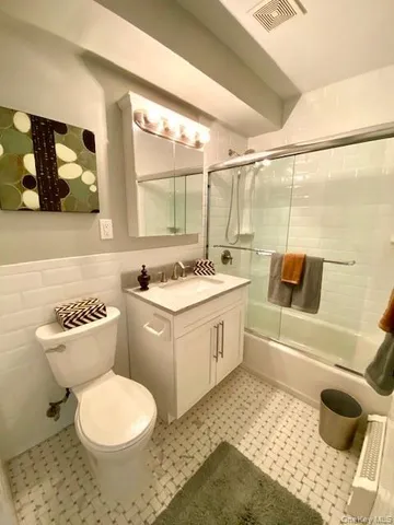 a bathroom with a sink a toilet and a bathtub