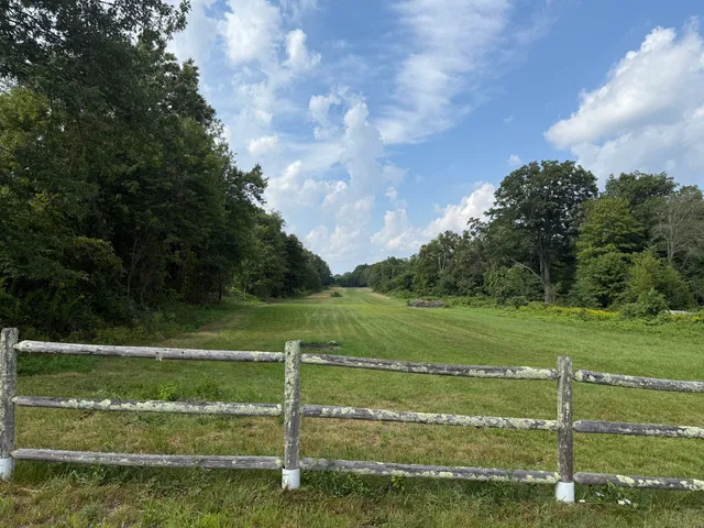 a view of a golf course with a lake