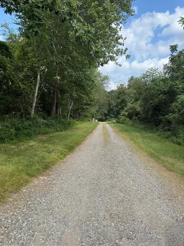 a view of a road with a yard