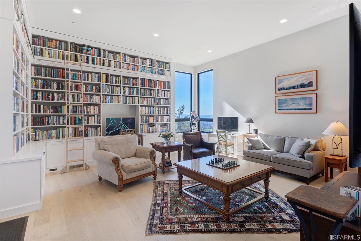 1538 Grand View Drive Berkeley, CA 94705 - Photo 17 of 30 a living room with furniture a rug and a fireplace