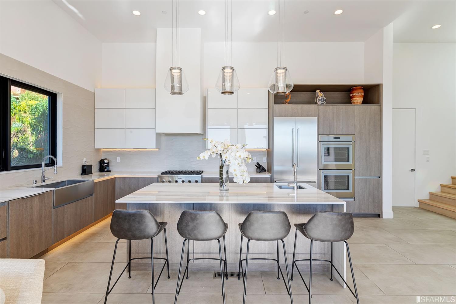 1538 Grand View Drive Berkeley, CA 94705 - Photo 8 of 30 a kitchen with stainless steel appliances kitchen island granite countertop a table and chairs