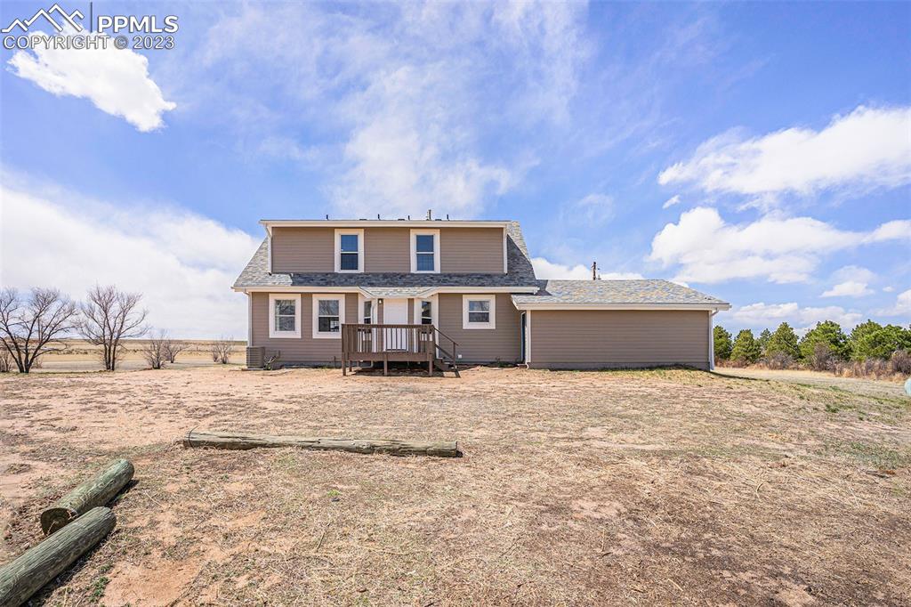 11615 Oil Well Road Calhan, CO 80808 - Photo 25 of 37 a front view of a house with a yard
