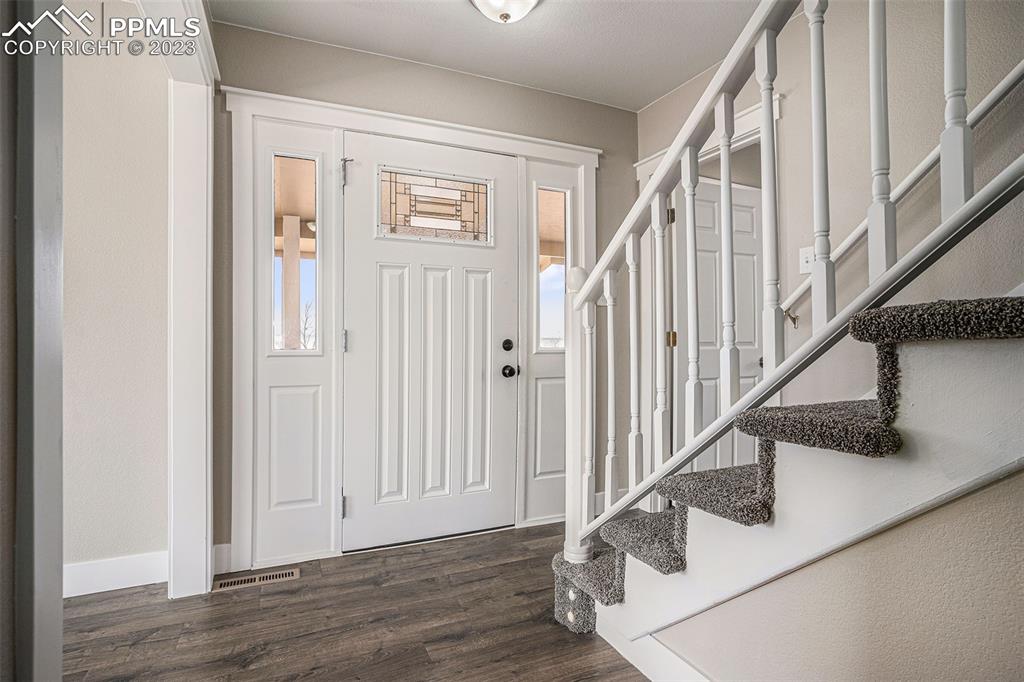 11615 Oil Well Road Calhan, CO 80808 - Photo 6 of 37 a view of entryway with wooden floor
