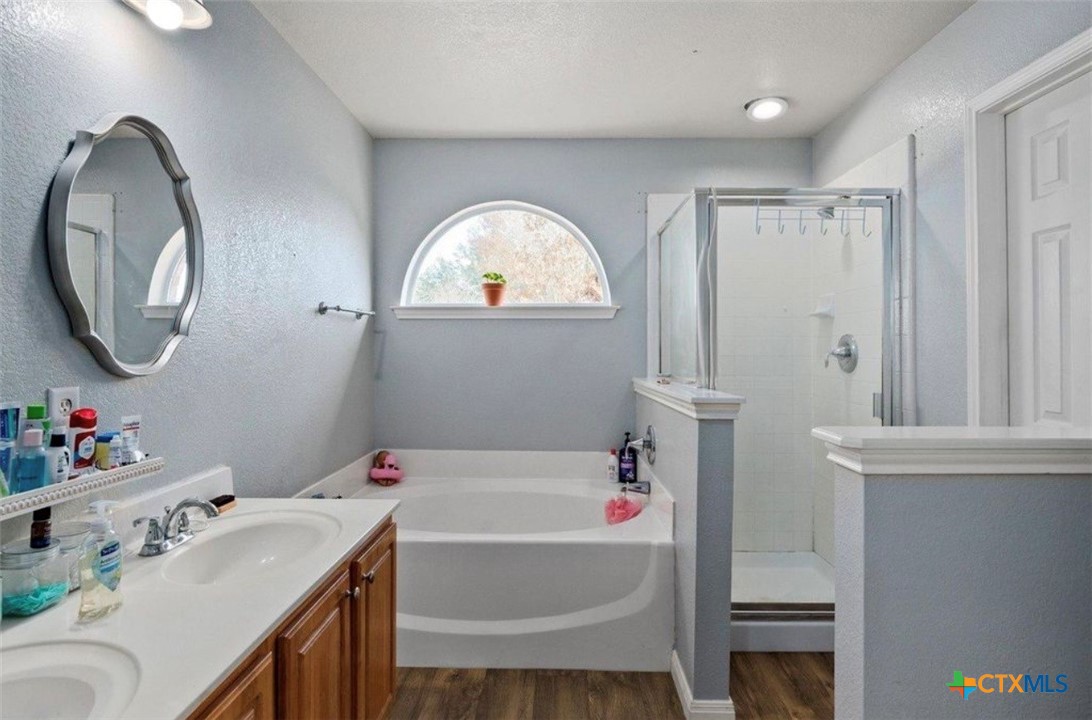 512 South Mockingbird Lane Lockhart, TX 78644 - Photo 14 of 22 a bathroom with a sink and a mirror