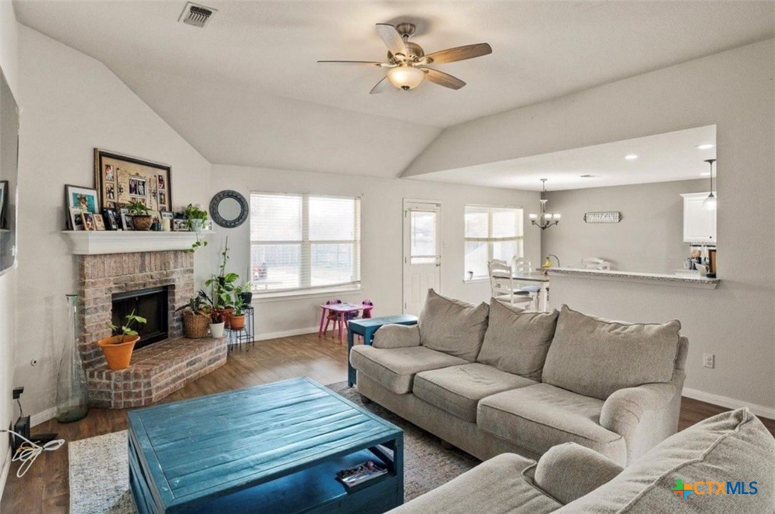 512 South Mockingbird Lane Lockhart, TX 78644 - Photo 4 of 22 a living room with furniture and a fireplace