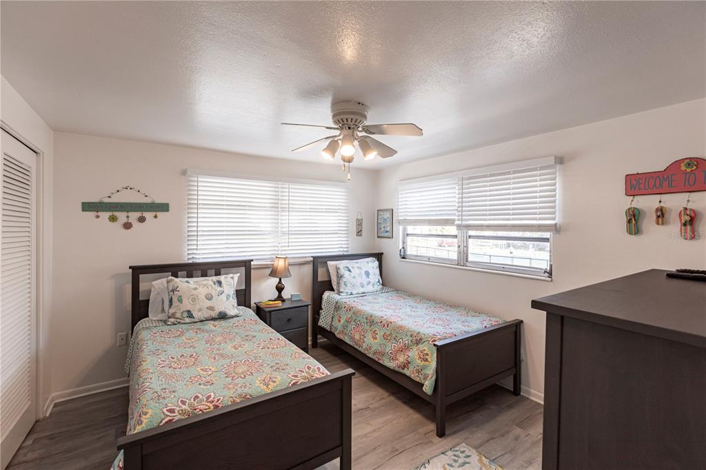 6020 Midnight Pass Road, Unit 50 Sarasota, FL 34242 - Photo 17 of 22 a bedroom with a bed and window