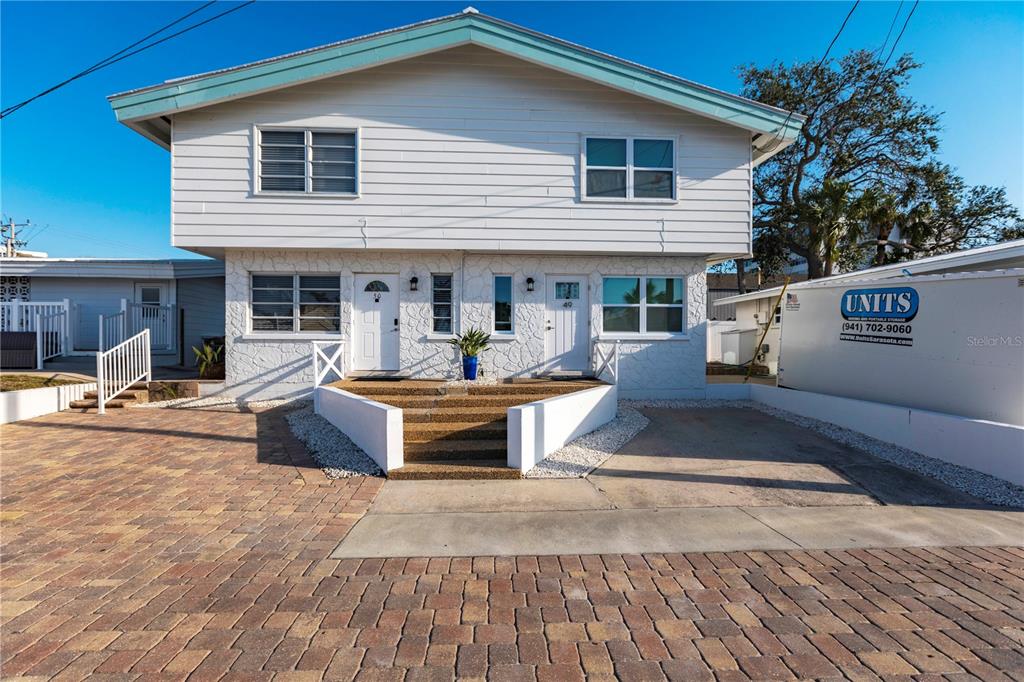6020 Midnight Pass Road, Unit 50 Sarasota, FL 34242 - Photo 2 of 22 a view of a house with sitting area