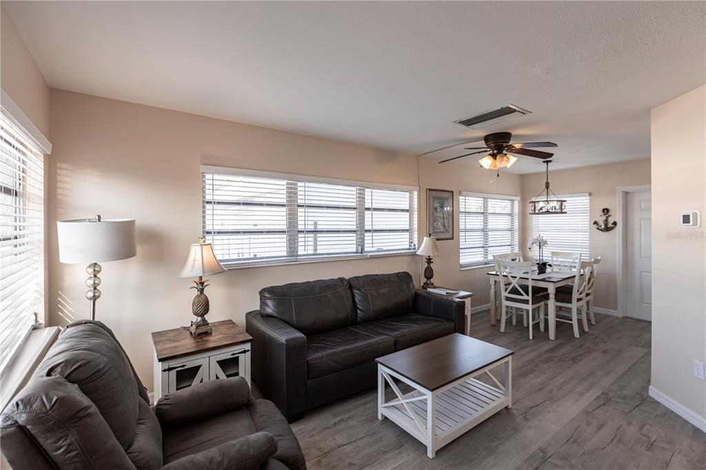 6020 Midnight Pass Road, Unit 50 Sarasota, FL 34242 - Photo 3 of 22 a living room with furniture and a large window