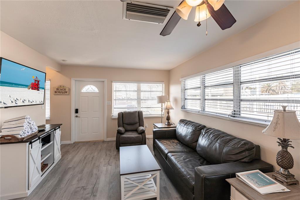 6020 Midnight Pass Road, Unit 50 Sarasota, FL 34242 - Photo 5 of 22 a living room with furniture and a large window