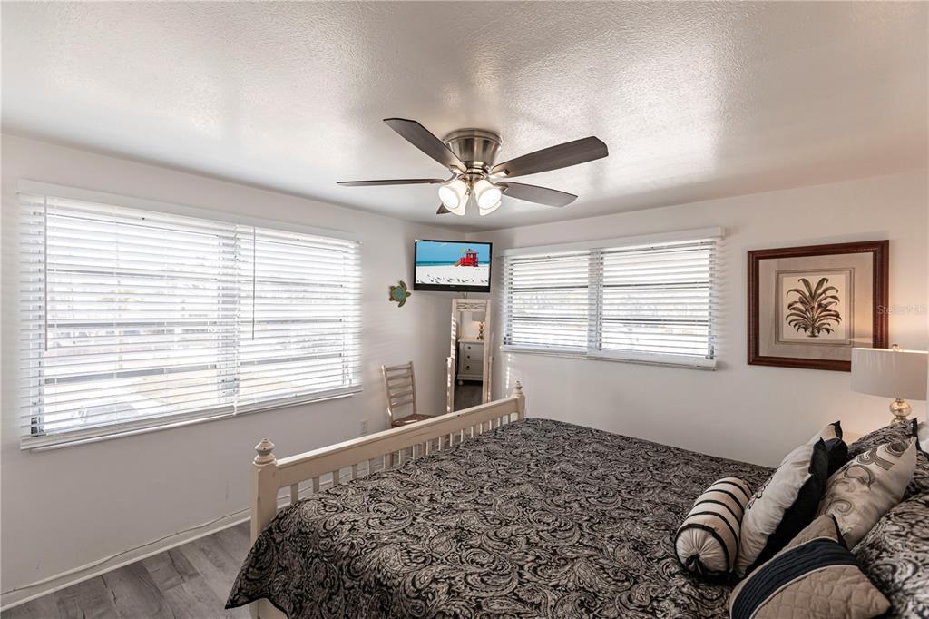 6020 Midnight Pass Road, Unit 50 Sarasota, FL 34242 - Photo 10 of 22 a bedroom with bed and a window