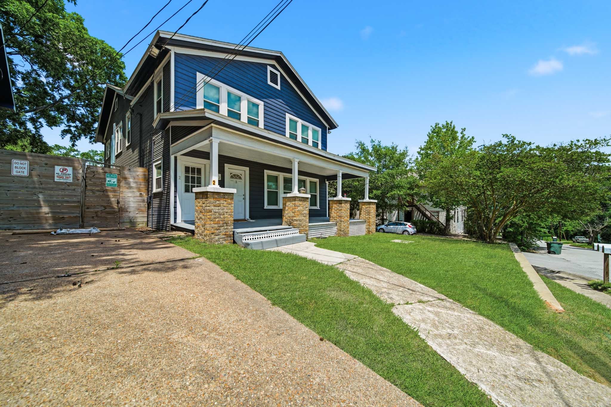 1302 20th Street Huntsville, TX 77340 - Photo 2 of 26 a front view of a house with a yard