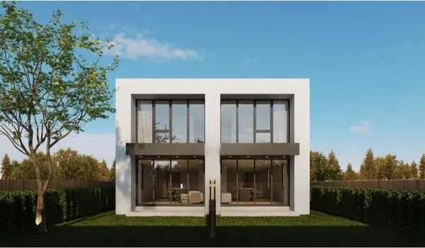 a view of a brick house with a floor to ceiling windows and yard