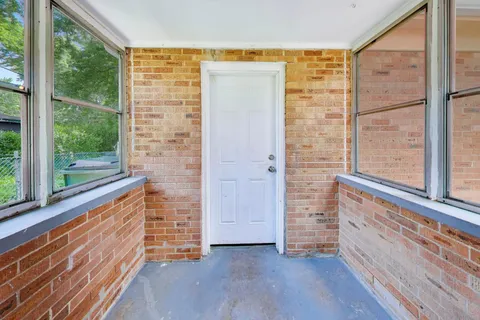 a view of front door with wooden floor