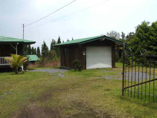 11-3108 Kahaualea Road Volcano, HI 96771 - Photo 4 of 25 a backyard of a house with plants and tree