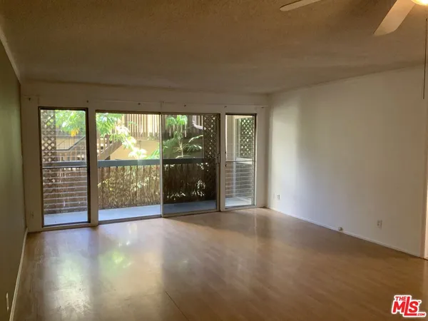 a view of a storage & utility room with wooden floor