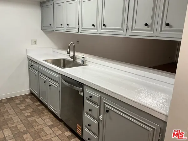 a view of a living room and a potted plants