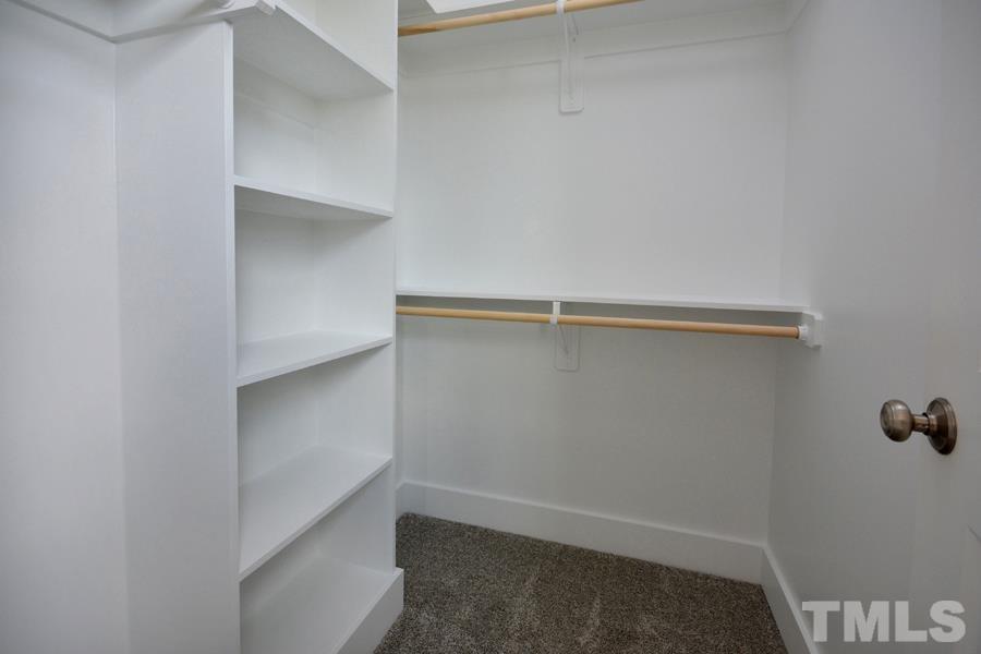 100 Southern Middle School Road Roxboro, NC 27573 - Photo 24 of 28 a view of walk in closet with empty racks