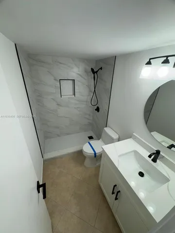 a bathroom with a sink and mirror