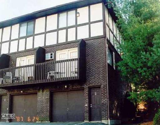 a view of a brick house with a large window
