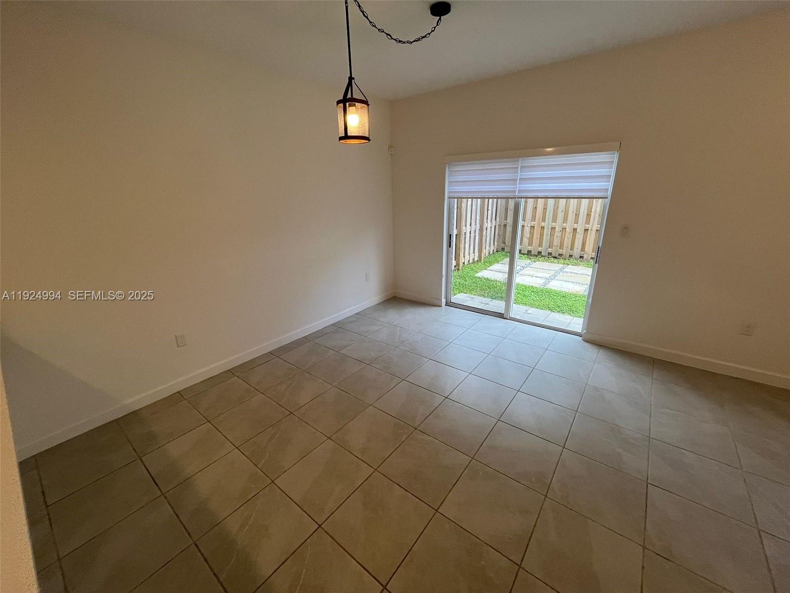 2602 Southeast 11th Street Homestead, FL 33035 - Photo 10 of 26 a view of an empty room with a window