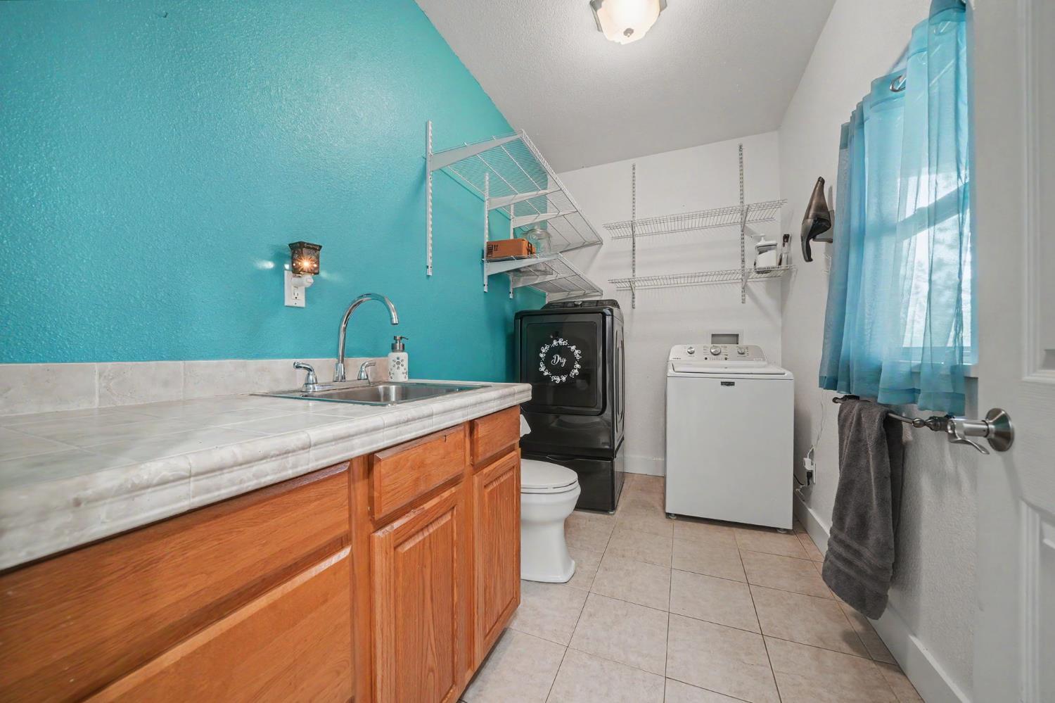 18461 Shake Ridge Road Sutter Creek, CA 95685 - Photo 22 of 77 Inside laundry room.