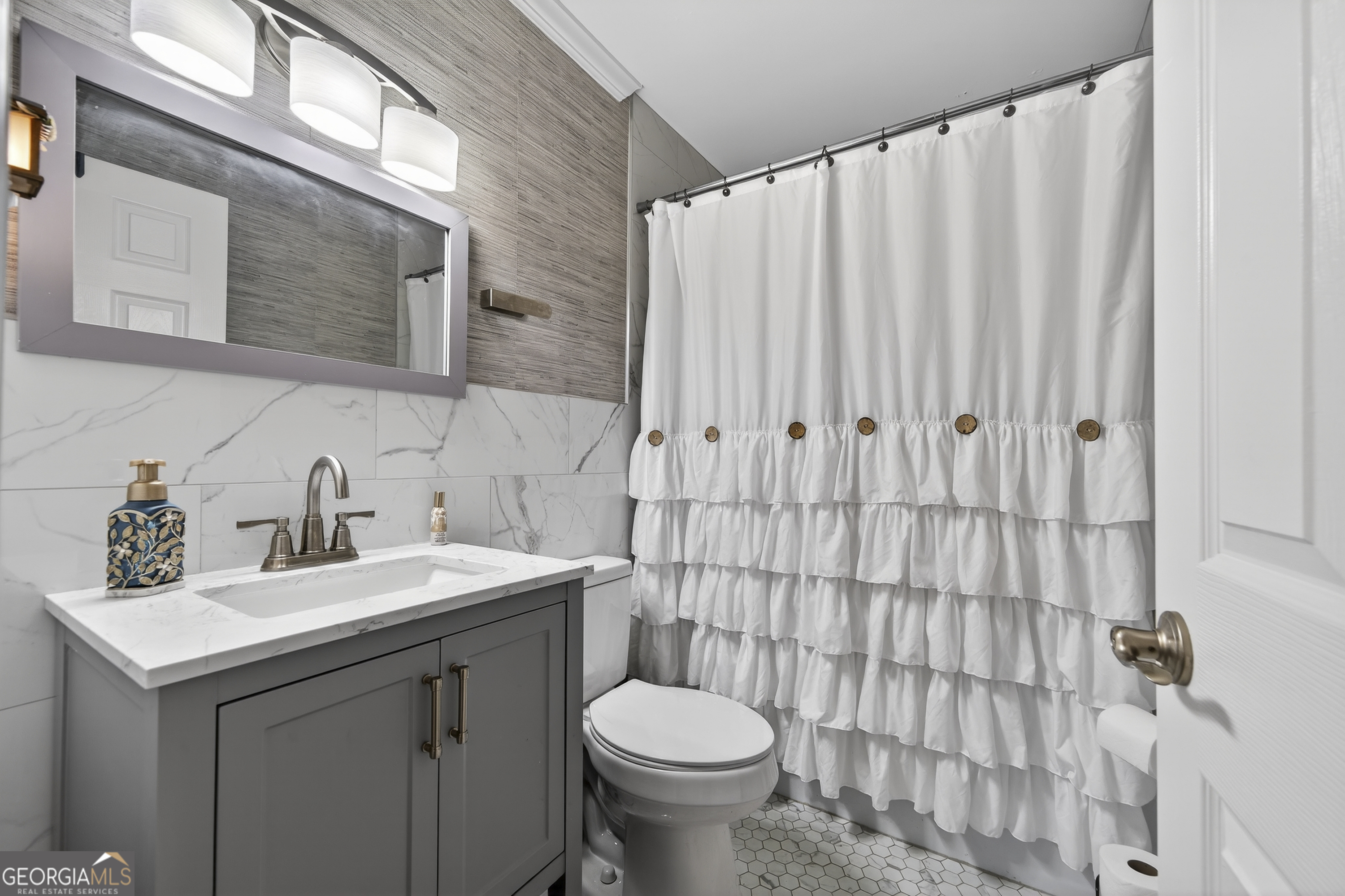 1739 Elmwood Road Milledgeville, GA 31061 - Photo 11 of 41 a bathroom with a sink toilet and shower