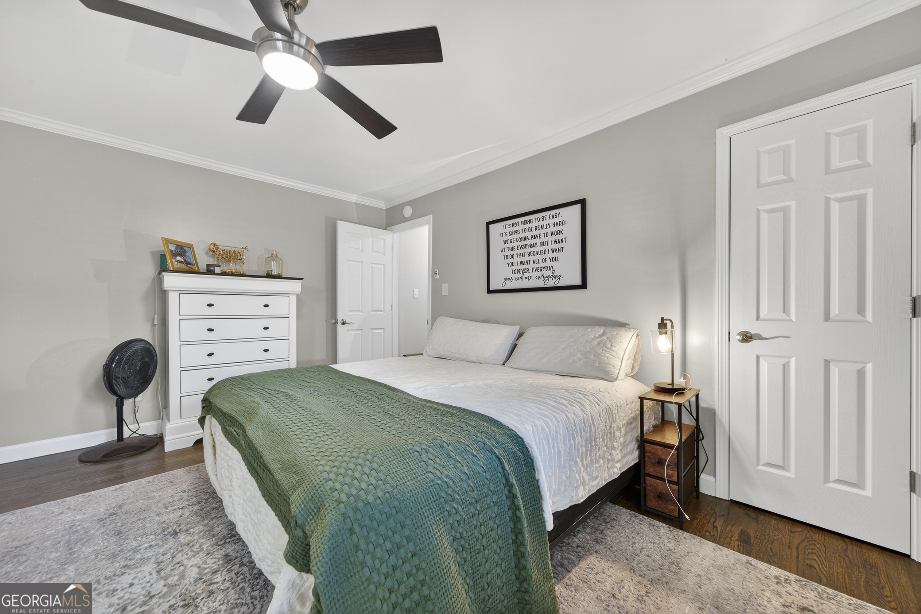 1739 Elmwood Road Milledgeville, GA 31061 - Photo 16 of 41 a bedroom with a bed and a chandelier