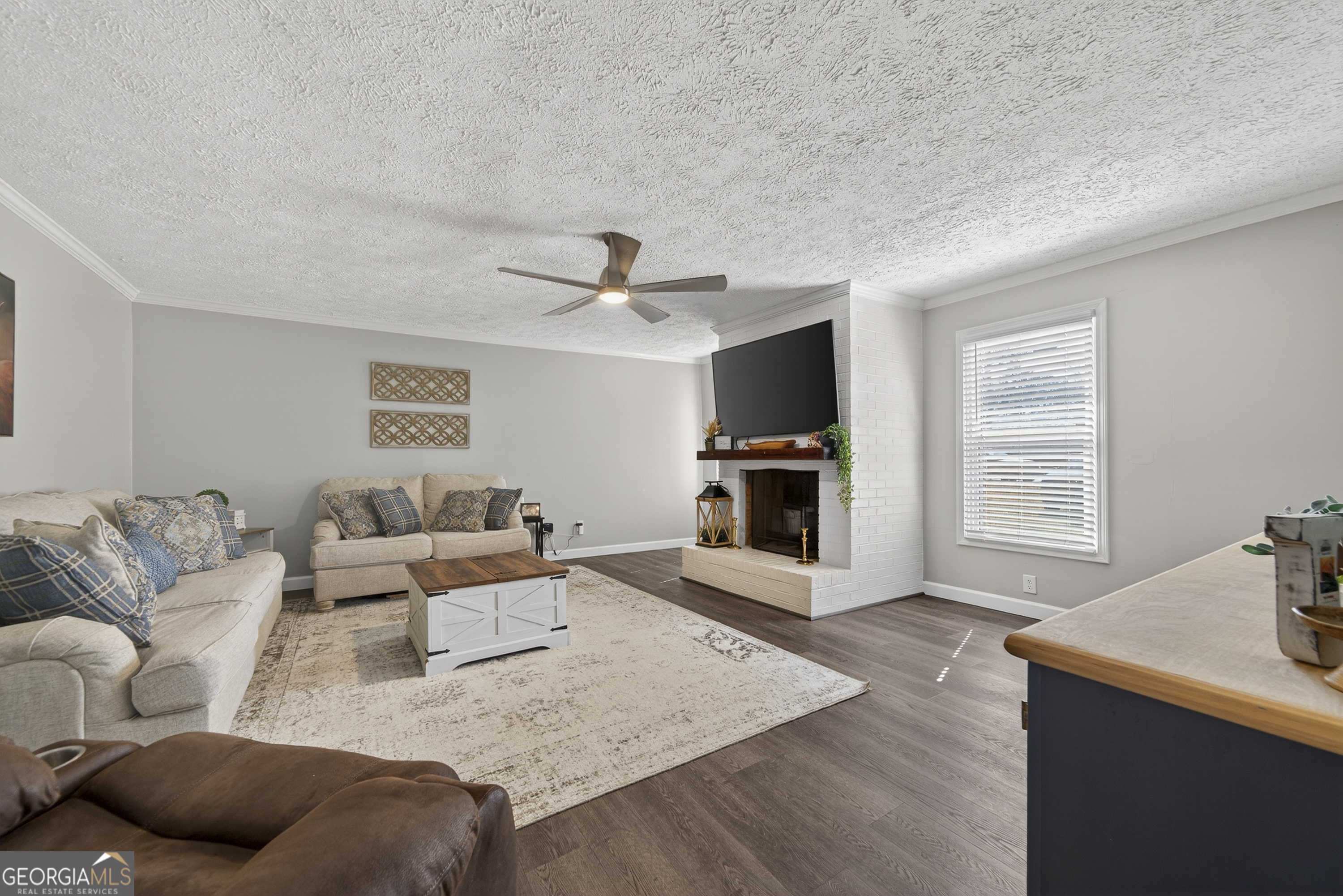 1739 Elmwood Road Milledgeville, GA 31061 - Photo 32 of 41 a living room with furniture and a wooden floor