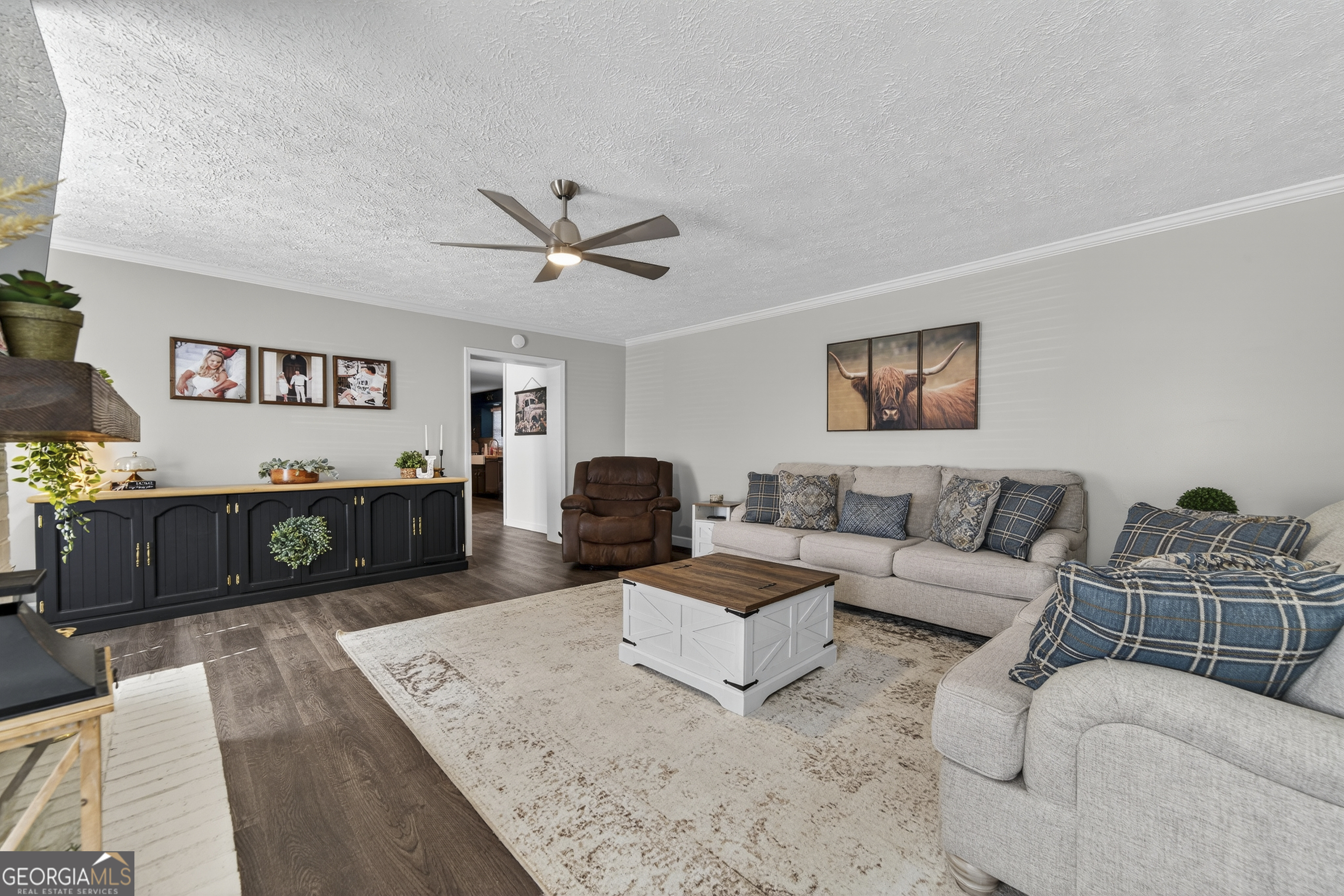 1739 Elmwood Road Milledgeville, GA 31061 - Photo 35 of 41 a living room with furniture and wooden floor