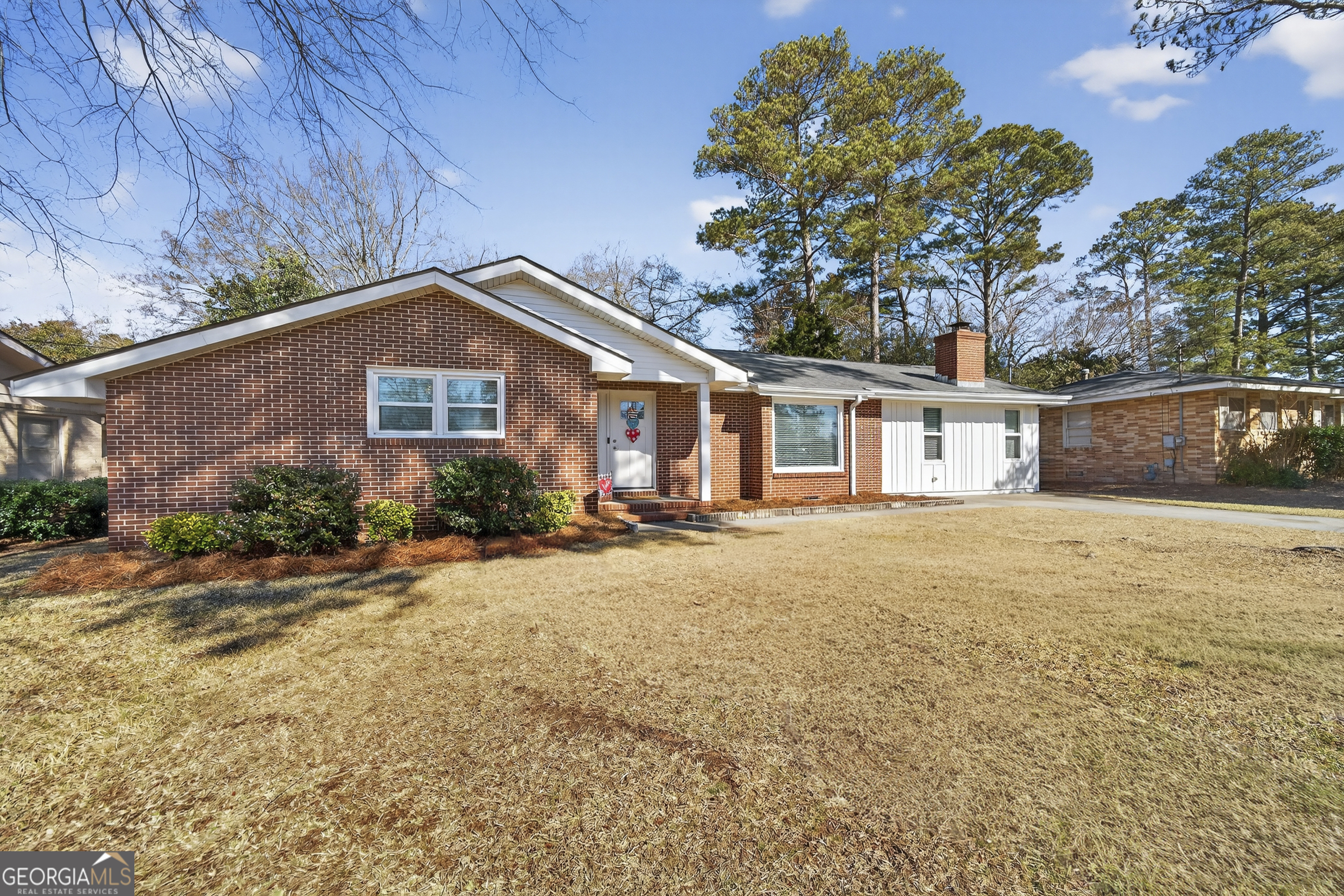 1739 Elmwood Road Milledgeville, GA 31061 - Photo 4 of 41 a front view of a house with a yard