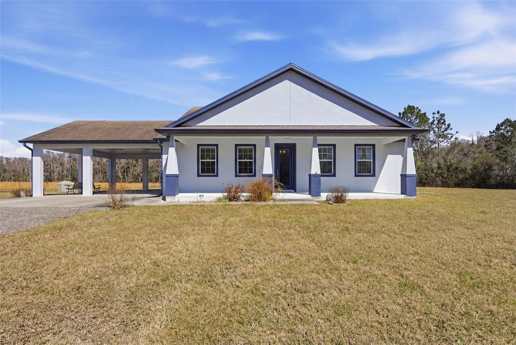4503 Colony Road New Smyrna Beach, FL 32168 - Photo 1 of 1 a view of a house with a swimming pool and chairs