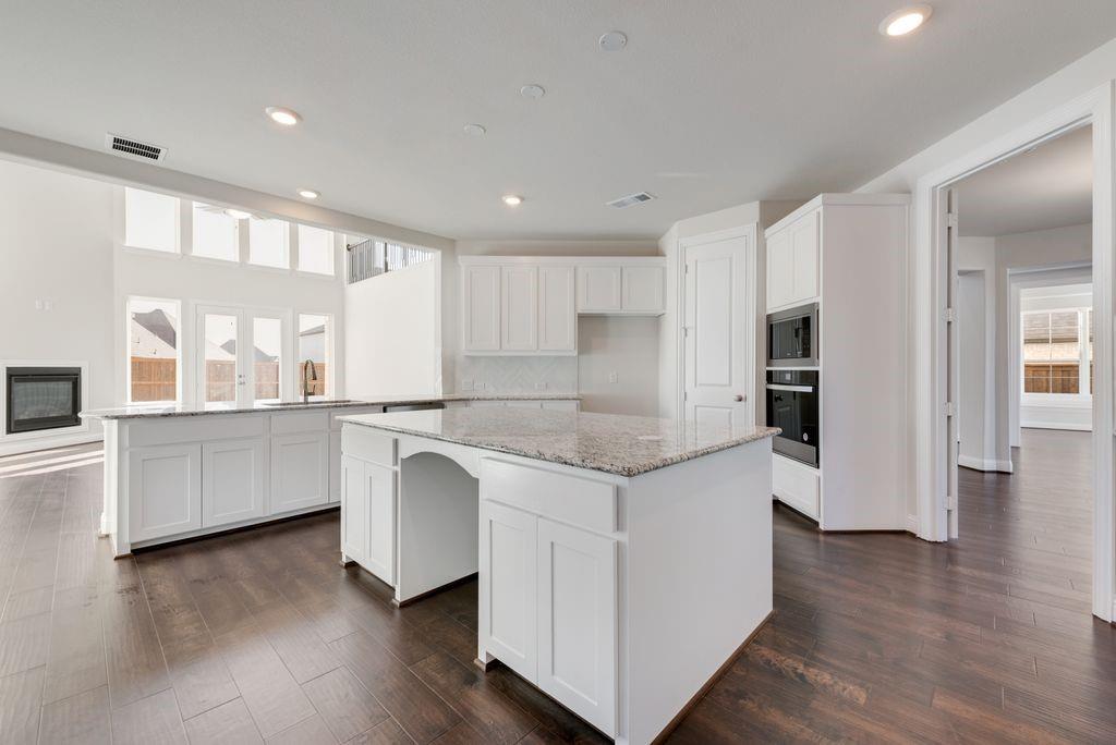 2438 Meridian Place Midlothian, TX 76065 - Photo 14 of 37 a kitchen with a white cabinets and counter space