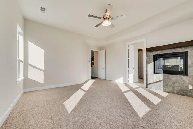 a view of an empty room with a fireplace