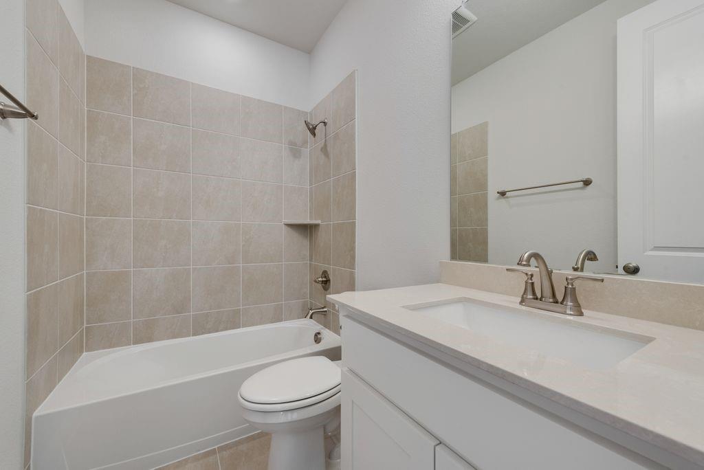 2438 Meridian Place Midlothian, TX 76065 - Photo 33 of 37 a bathroom with a sink a toilet and shower