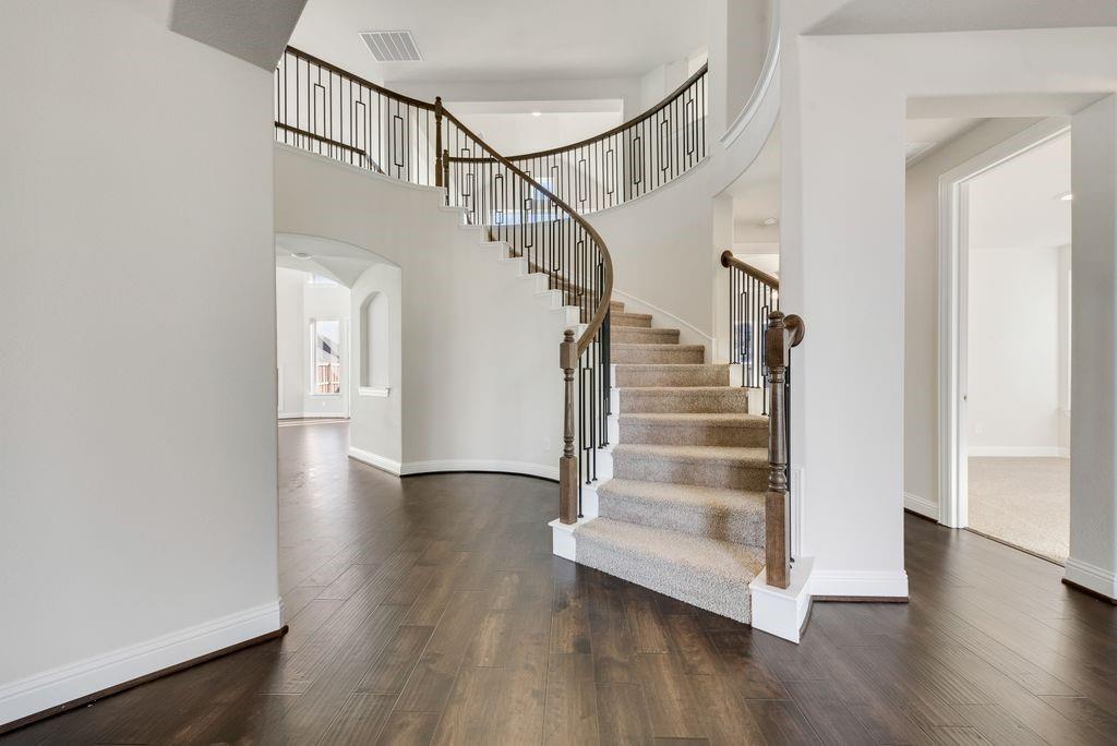 2438 Meridian Place Midlothian, TX 76065 - Photo 7 of 37 a view of entryway and hall with wooden floor