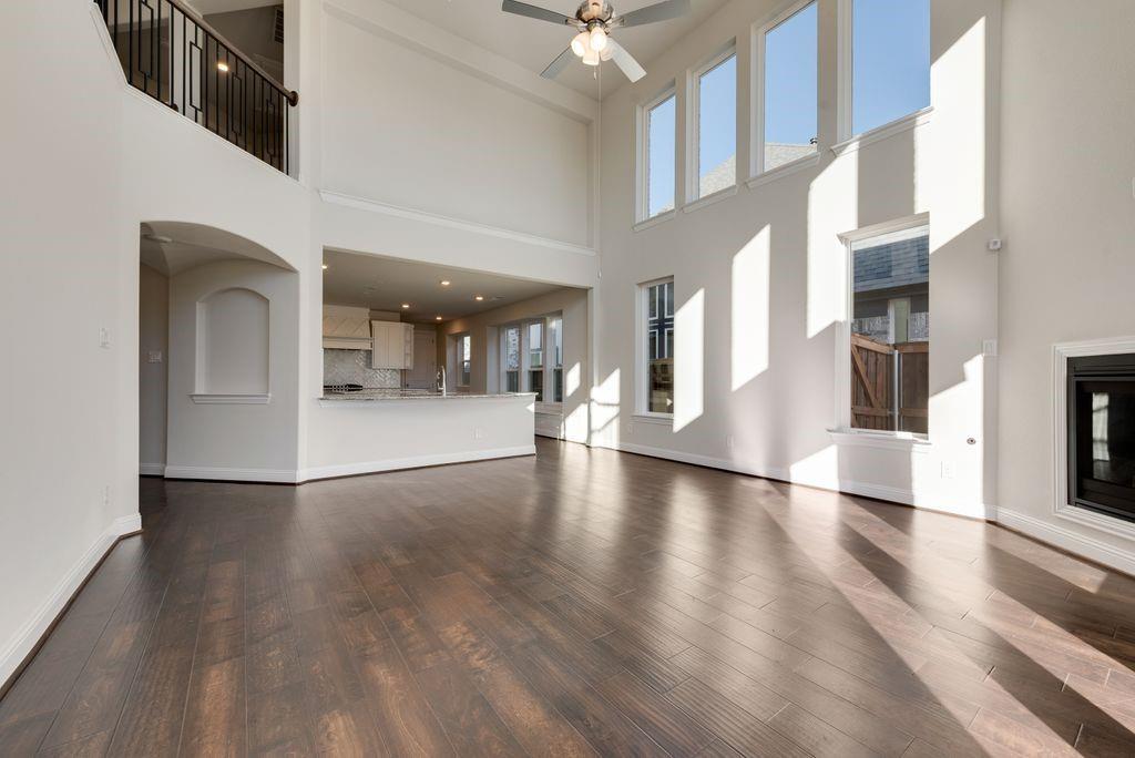 2438 Meridian Place Midlothian, TX 76065 - Photo 10 of 37 wooden floor in an empty room with a window