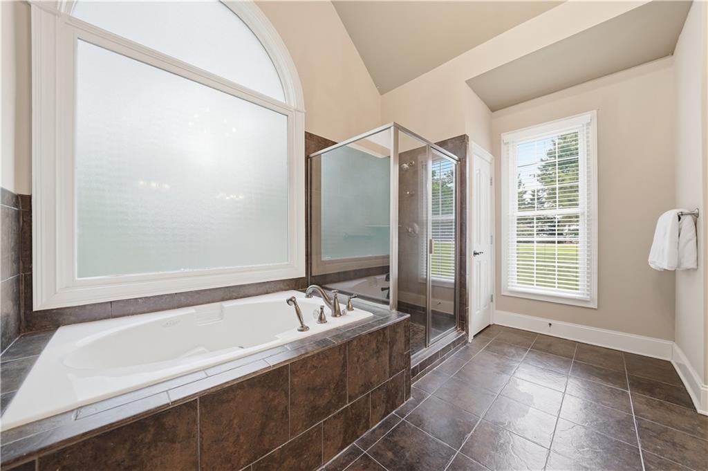 97 Eagle Ridge Trail Cleveland, GA 30528 - Photo 35 of 58 a spacious bathroom with a bathtub and a shower