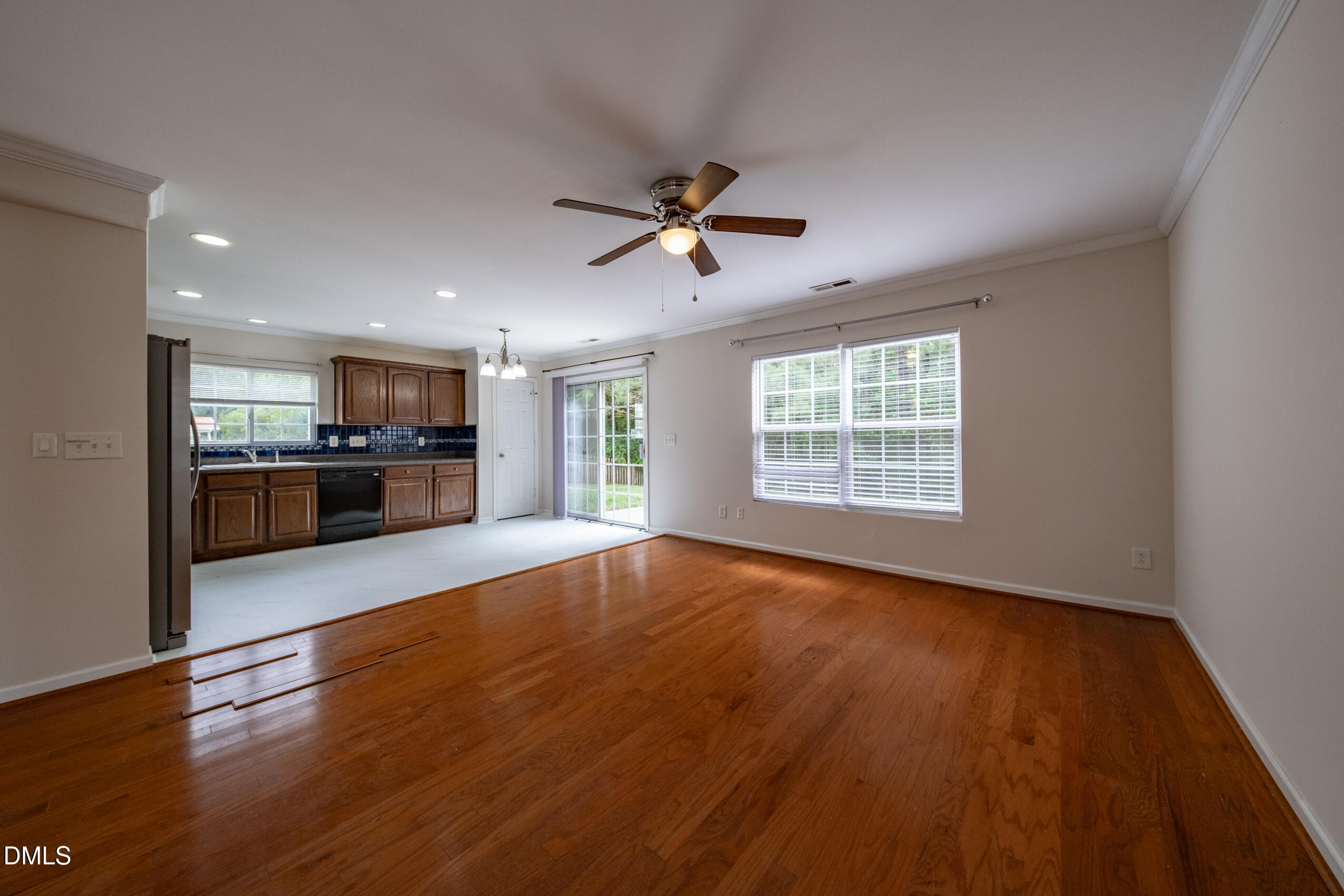 719 Obsidian Way Durham, NC 27703 - Photo 11 of 41 a view of an empty room with window and wooden floor