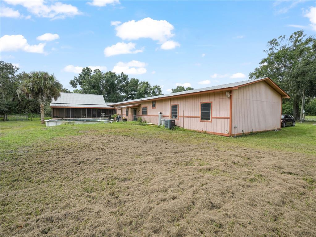 4485 Murphy Road Ona, FL 33865 - Photo 35 of 41 a backyard of a house with table and chairs