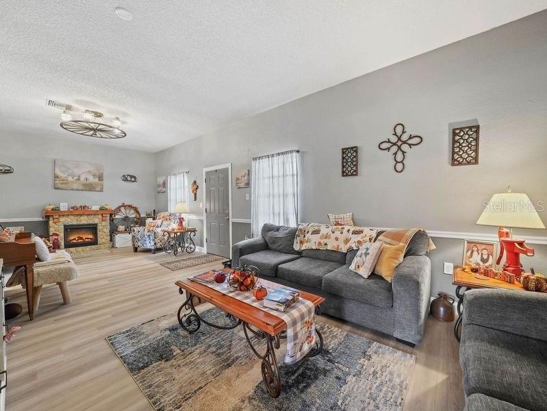 4485 Murphy Road Ona, FL 33865 - Photo 4 of 41 a living room with furniture a rug and a table