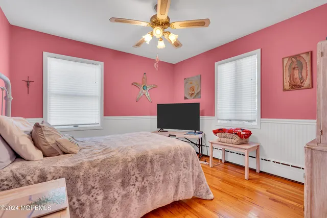 a living room with furniture and a lamp
